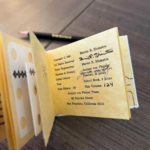 Autographs of author and printer in Sun Cat, PS3558.I32 S85 1986