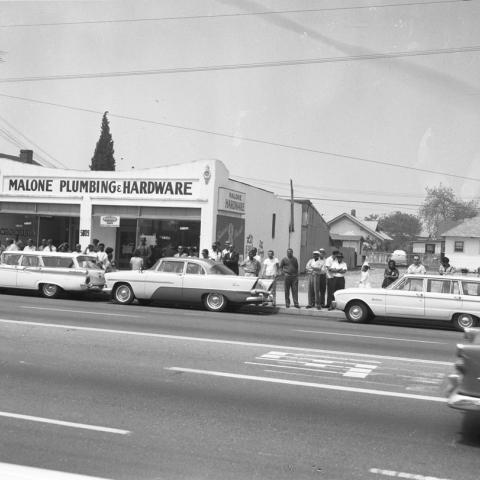 A crowd gathered across the street from Mosque No. 27 during the funeral of Ronald Stokes. Harry Adams Photograph Collection