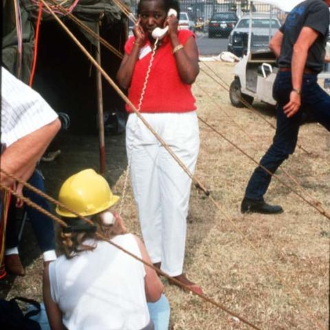 Then-CSUN President Blenda Wilson speaks on the phone outside a tent on campus