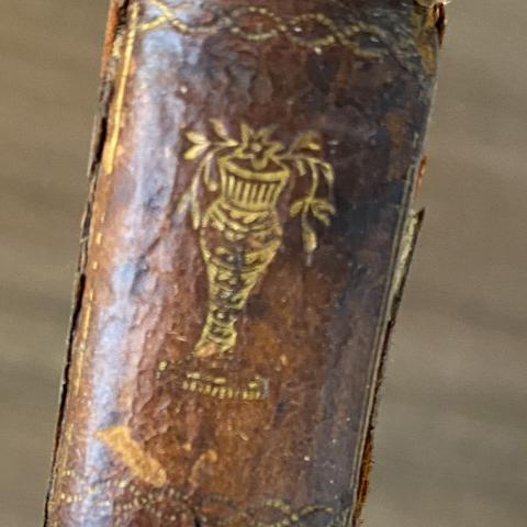 Imprinted gold amphora vase on the spine of The Castle of Otranto PR3757.W2 C3 1786	