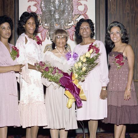 Norma Madkim posing with guests at her retirement luncheon, 1978, Jack Davis Photograph Collection, Box 17 Folder 6.