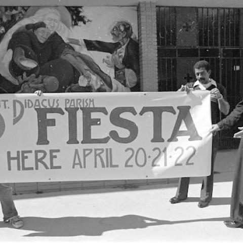 St. Didacus church members holding a “Fiesta” banner, March 21(?), 1979, Robert and Betty Franklin Collection
