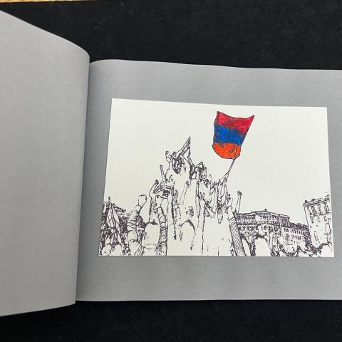 white paper on gray background with illustration of people with an Armenian flag gathered in a town square, the illustration is black and white with the exception of the flag, which is red, blue and orange; Armenian Velvet Revolution 2018 by Nina Avadisrostamain, N7433.4.A83 A76, 2019