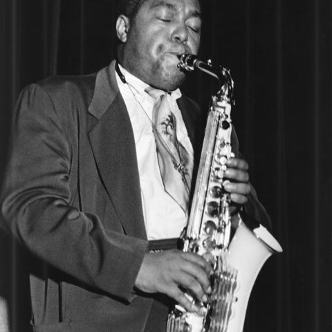 Charlie Parker playing saxophone in Riverside, Riverside, 1953.