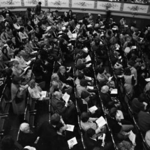 Interior of opera house, with audience on orchestra level