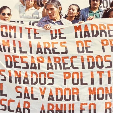 Image from collection selected by Student Assistant, Jenesy: A group of elderly women holding a banner that says, “Comité De Madres Y Familiares De Preso Desaparecidos Y Asesinados Políticos El Salvador Monseñor Oscar Arnuleo Romero, 1983.