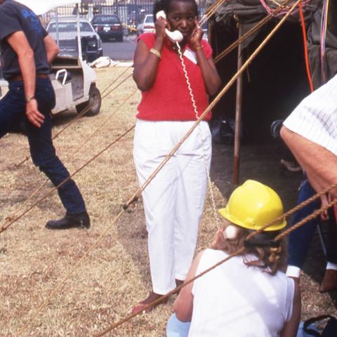President Wilson working on reconstruction with a land line, Spring 1994, University Archives Photograph Collection, Box 46