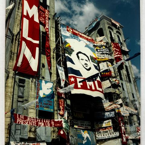 Image from collection selected by Student Assistant, Veronica: FMLN and other popular movement banners hang off the Metropolitan Cathedral in San Salvador, El Salvador, 1994.