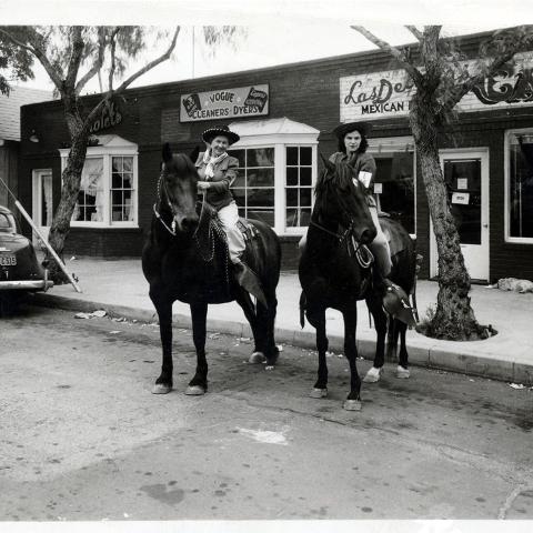 Saddled up for Fiesta Days in front of the Las Delicias Café, 1946