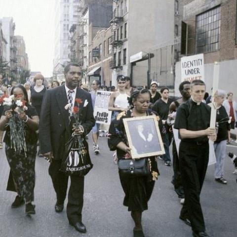 Reverend Pat Bumgartner leads the procession to Port Authority bus terminal