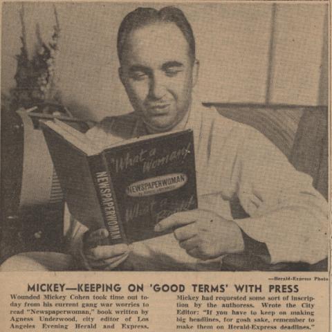 Cohen poses with Underwood's book, "Newspaperwoman"