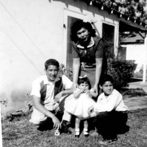 Paula, Alfredo, Alfredo Jr., and Armida Lopez in front of their Pacoima home, circa 1955