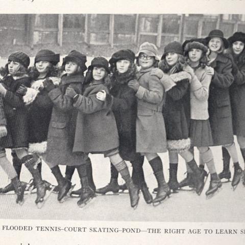 A group of children learning to skate on a flooded tennis court from The Art of Skating