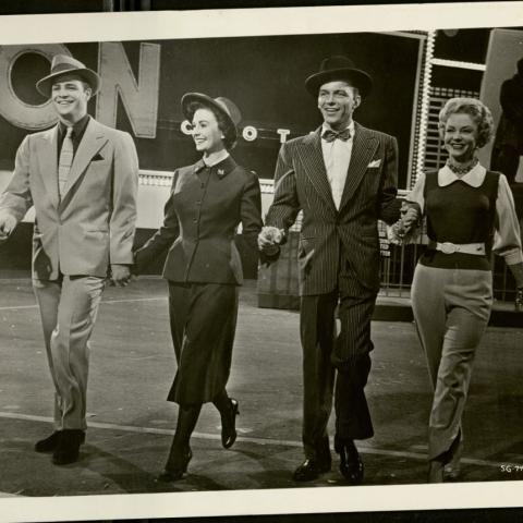 Left to right: Marlon Brando, Jean Simmons, Frank Sinatra, and Vivian Blaine on the set of Guys and Dolls