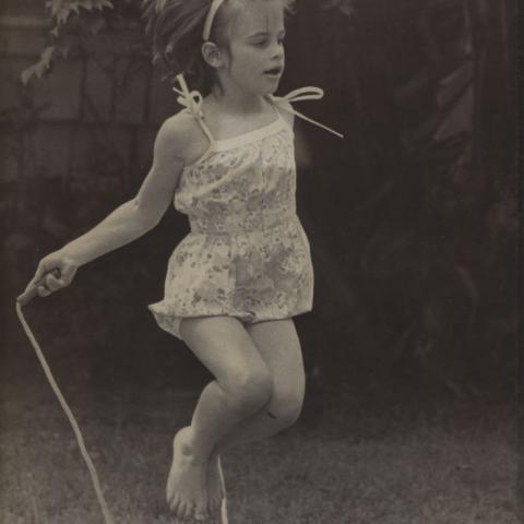 Little girl jumping rope