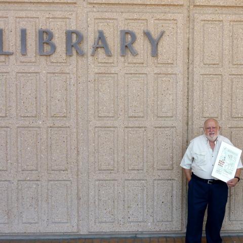 Dr. Robert Gohstand holds his Plant Atlas