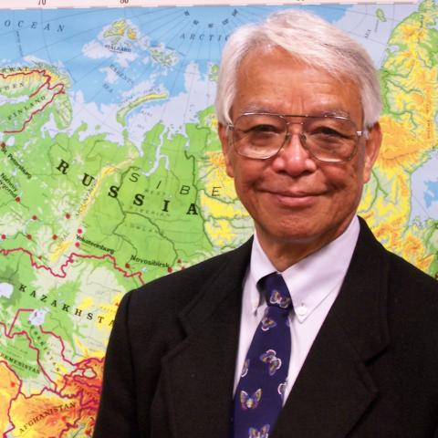 man in front of map
