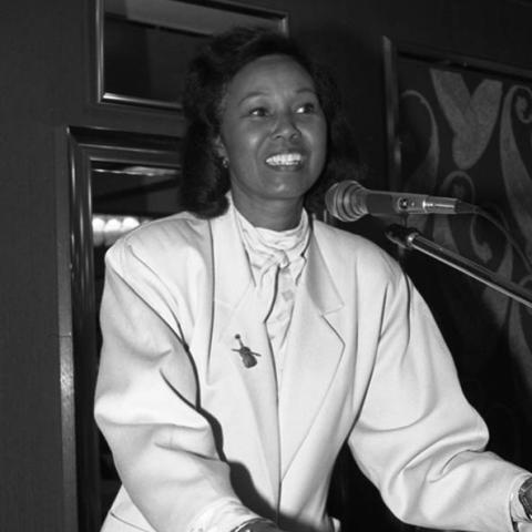 Yvonne Brathwaite Burke speaking at lectern. 1992. Digital ID: 11.06.GC.N35.B5.46.146.20