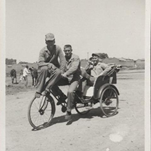China Marines pose on a rickshaw