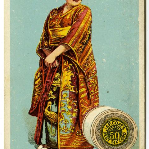 Katisha, from the Gilbert and Sullivan opera "Mikado" wearing a kimono and standing next to a large spool of thread. HF 5851 G44_16_03