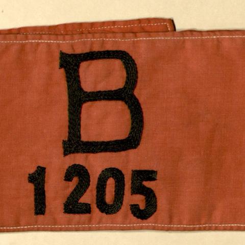 Arm band identifying Gloria Watson Curtis Kliene as a British national 