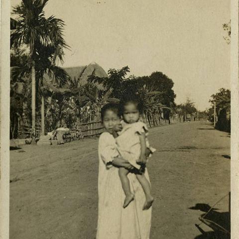 Photograph of two unidentified children and shadows of soldiers, ca. 1910. Donald Hiram Stilwell Photograph Collection
