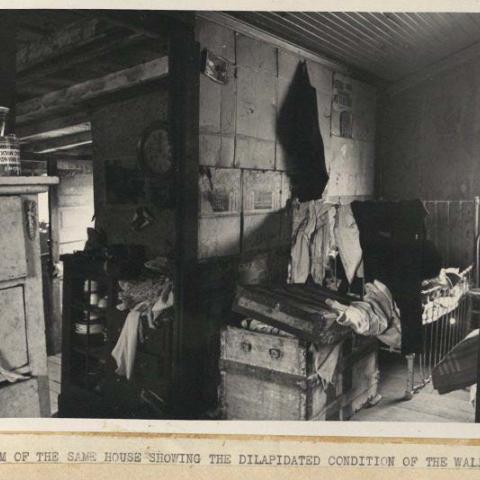 Photograph of the interior of a dilapidated house