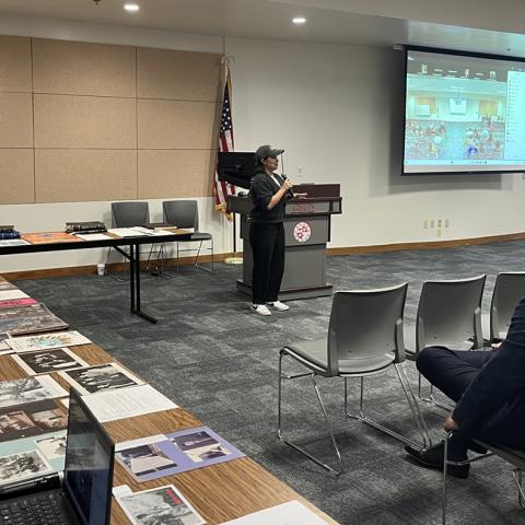 Jenesy Laso speaking at the community event for the opening of the El Rescate Collection