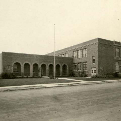 Two story Spanish influenced red brick elementary school in Los Angeles area, ca. 1930           