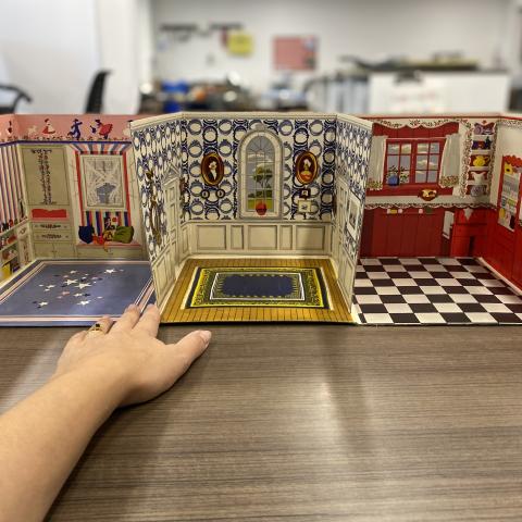 Fully unfolded dollhouse from The Fold-Away Doll House and Play Book of Cut-Out Furniture, TT174.5.P3 F6 1949