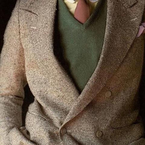 Model wearing warm earth tone colors with a double breasted jacket of thicker texture, in Dressing Right: A Guide for Men, 1978