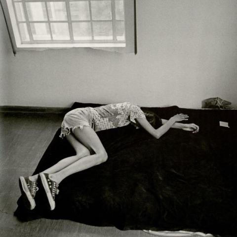 Vicky lays alone, hungover after a night of drugs and partying with their friends