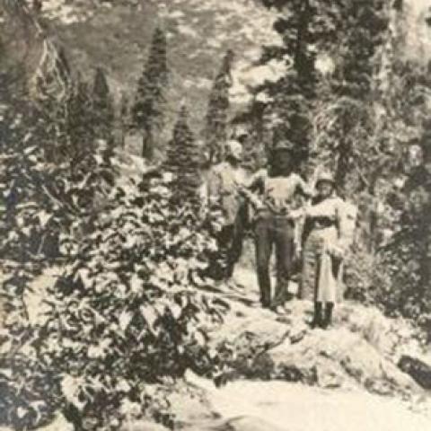 Hikers standing on a mountain, ca. 1922