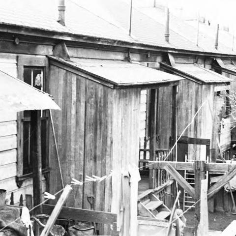 View of connected homes in a location that is now occupied by William Mead Homes public housing project in Chinatown.