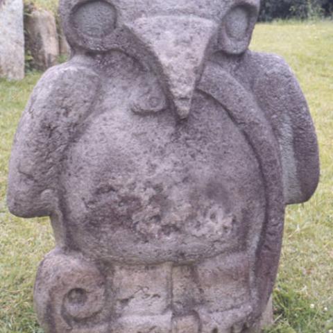 Stone statue of an eagle holding a snake standing at the Mesita B site of San Agustín Archaeological Park. Photo taken in 1975. Digital ID: 99.01.RCr.sl.B17.04.22.09