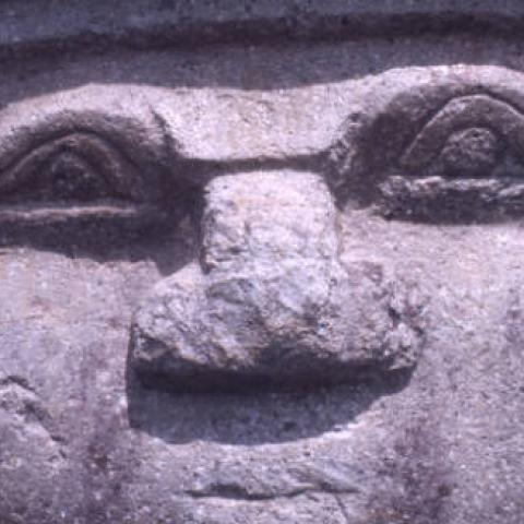 Close-up view of sculpture's face belonging to a crouching woman at the Alto de las Piedras site of San Agustín Archaeological Park. Photo taken in 1975. Digital ID: 99.01.RCr.sl.B17.04.25.13