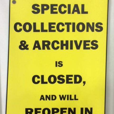 Sign, "Special Collections and Archives is closed and will reopen in August."