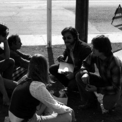 Designer John Banks and his team in a group meeting