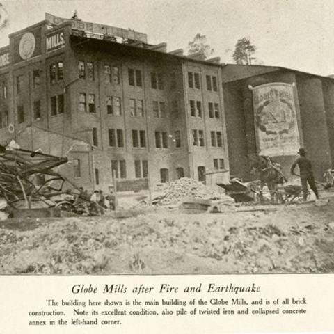 Photograph of Globe Mills, a brick building, surrounded by debris, in Burnt Clay Products in Fire and Earthquake