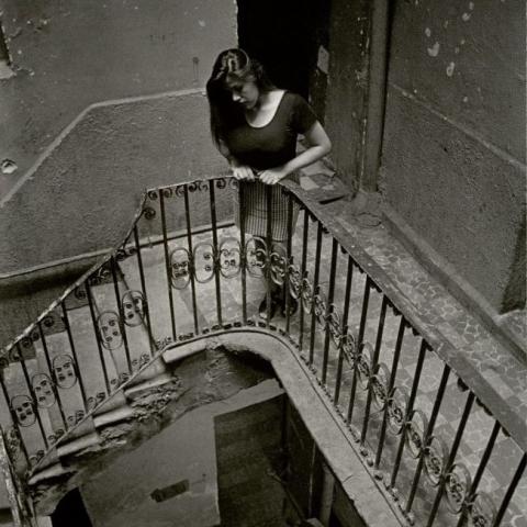 Norma waits for a client as he walks up the stairs