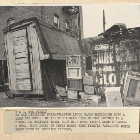 Photograph of makeshift shelters from broken-down trucks