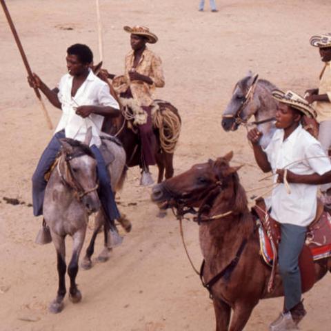 Picadors riding horses inside bullfight arena, San Basilio de Palenque, 1976