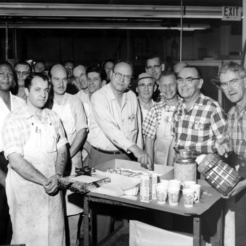 Group portrait at Bendix Corporation plant. Raymond Carter is visible at far left, 1960 