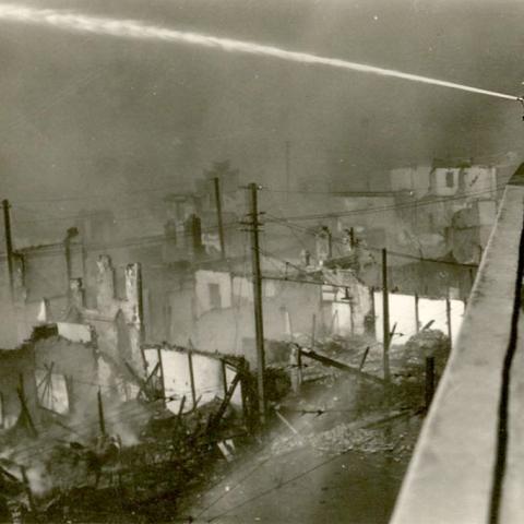 Firefighters at work the day after Japanese bombing of Shanghai, 1937