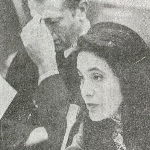 Dolores Huerta speaking into a microphone during a hearing of a farm labor bill. Julian Nava Collection