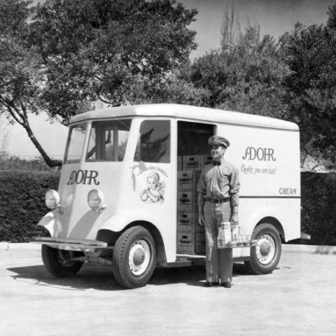 Adohr Farms delivery truck and milkman, ca. 1936