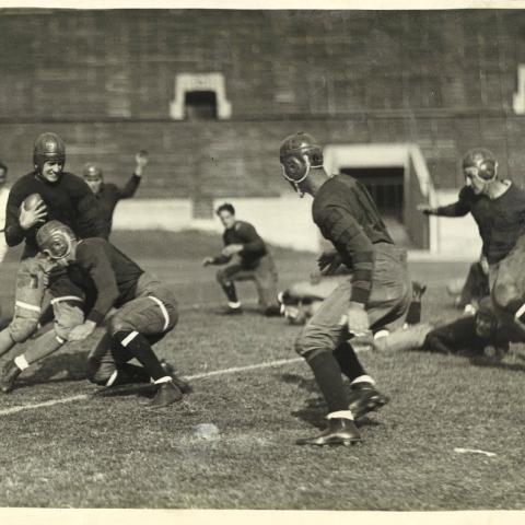 Photograph of Occidental College football players in action, taken by Carroll Photo Service, ca. 1920s