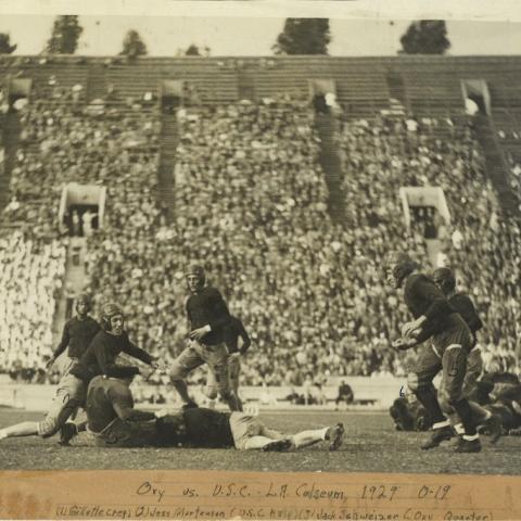 Scrapbook page partial newspaper clipping, Bengals Roar, and photograph of Occidental College and University of Southern California football players at the L.A. Coliseum, 1929