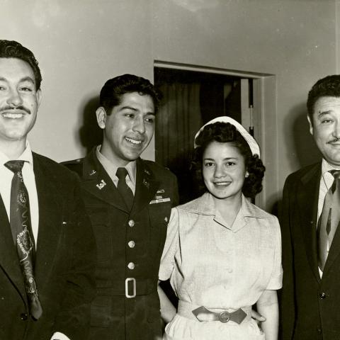 Photograph of Medal of Honor recipient Lieutenant Joseph C. Rodriguez making a guest appearance on a Spanish language television show, 1954