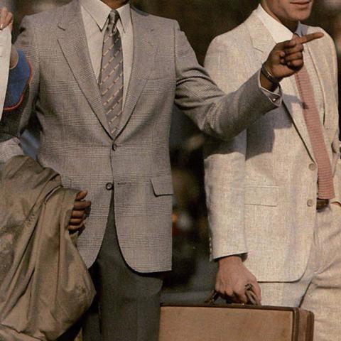 Model on left successfully displaying an ensemble of grey, in Playboy Fashion, vol. 3-4, 1982-1983